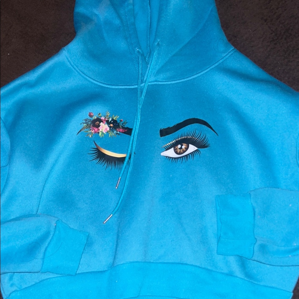Turquoise Hoodie with Eye Graphic